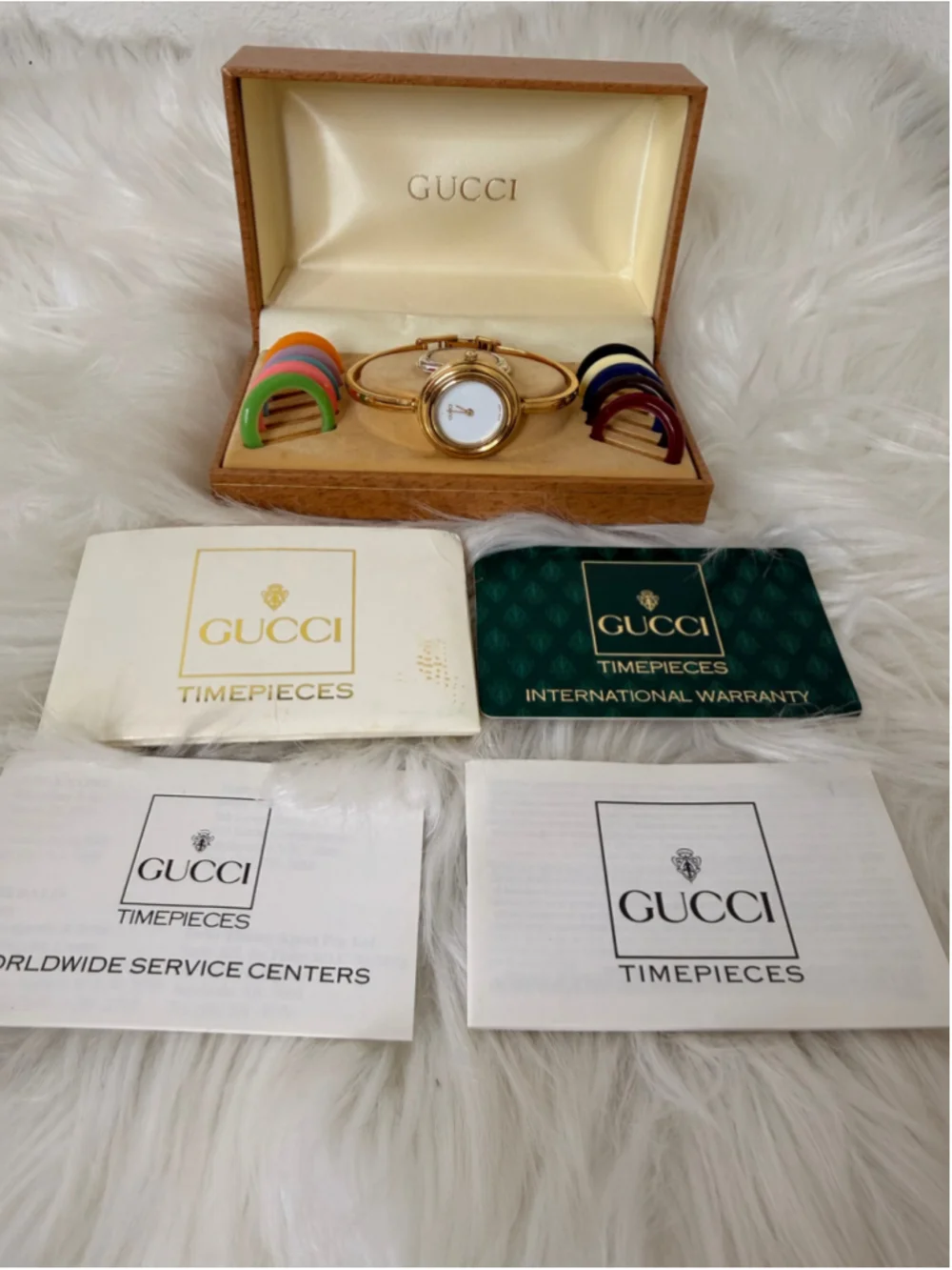 Gucci 11/12.2 Interchangeable Bezel Bangle Watch, w/ 12 bezels, box & paperwork
